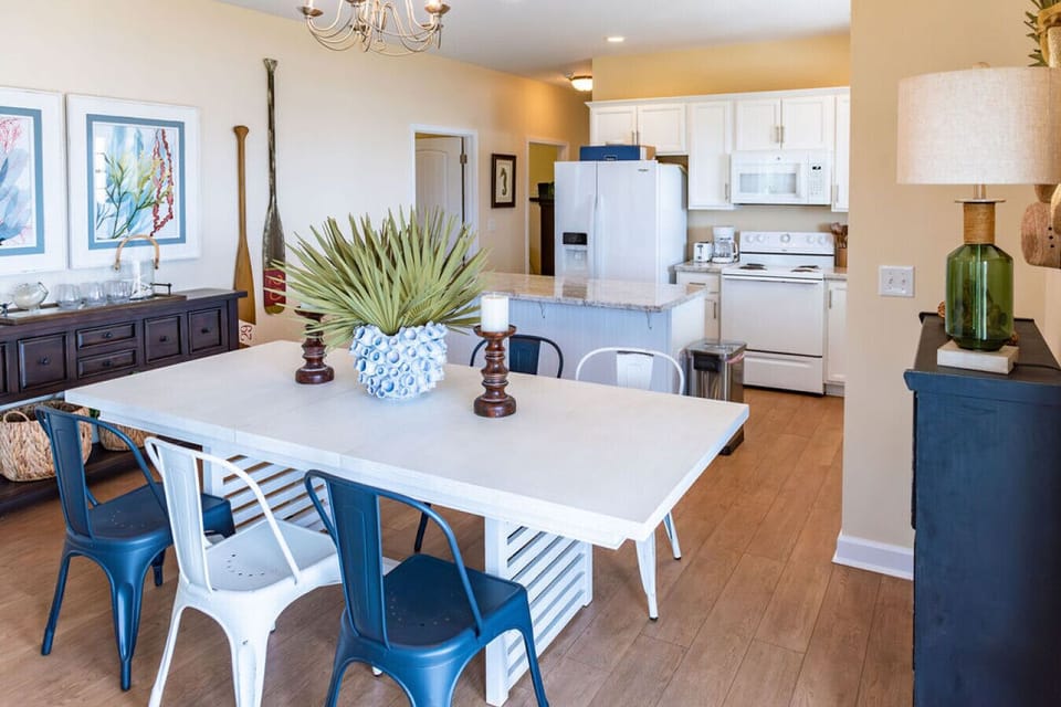 Dining area with seating and connected kitchen space