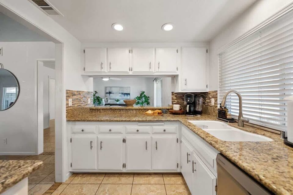 Kitchen: Spacious and fully equipped with modern appliances, cookware, and dinnerware, perfect for preparing home-cooked meals and enjoying family gatherings with ease.

