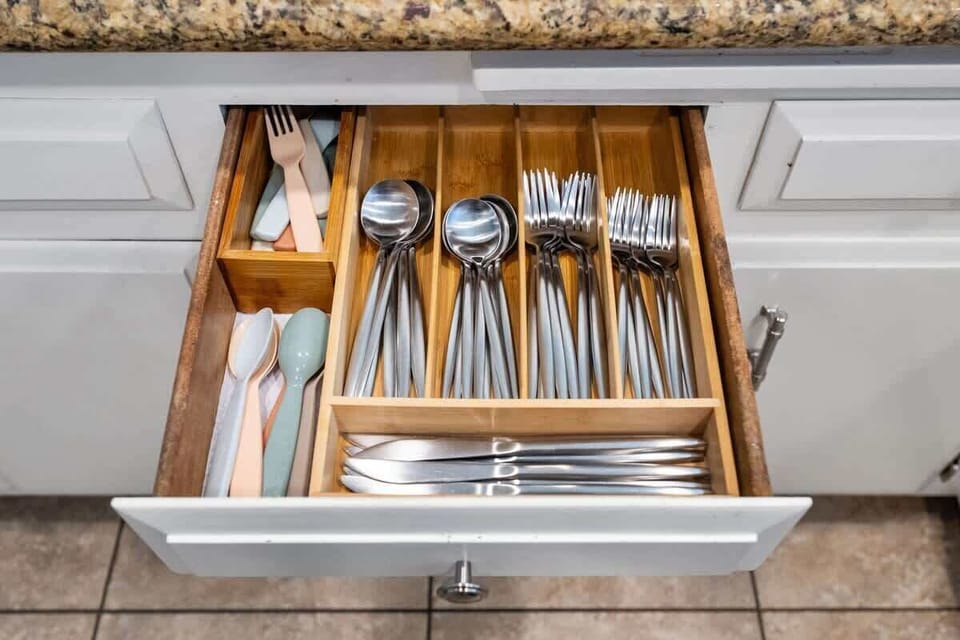 Kitchen: Spacious and fully equipped with modern appliances, cookware, and dinnerware, perfect for preparing home-cooked meals and enjoying family gatherings with ease.
