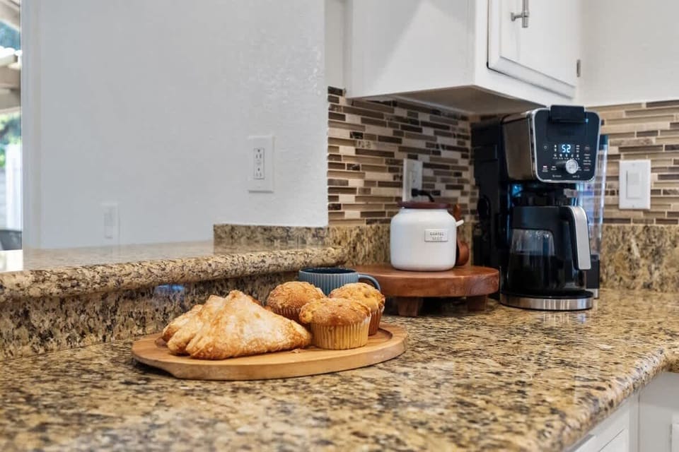 Kitchen: Spacious and fully equipped with modern appliances, cookware, and dinnerware, perfect for preparing home-cooked meals and enjoying family gatherings with ease.
