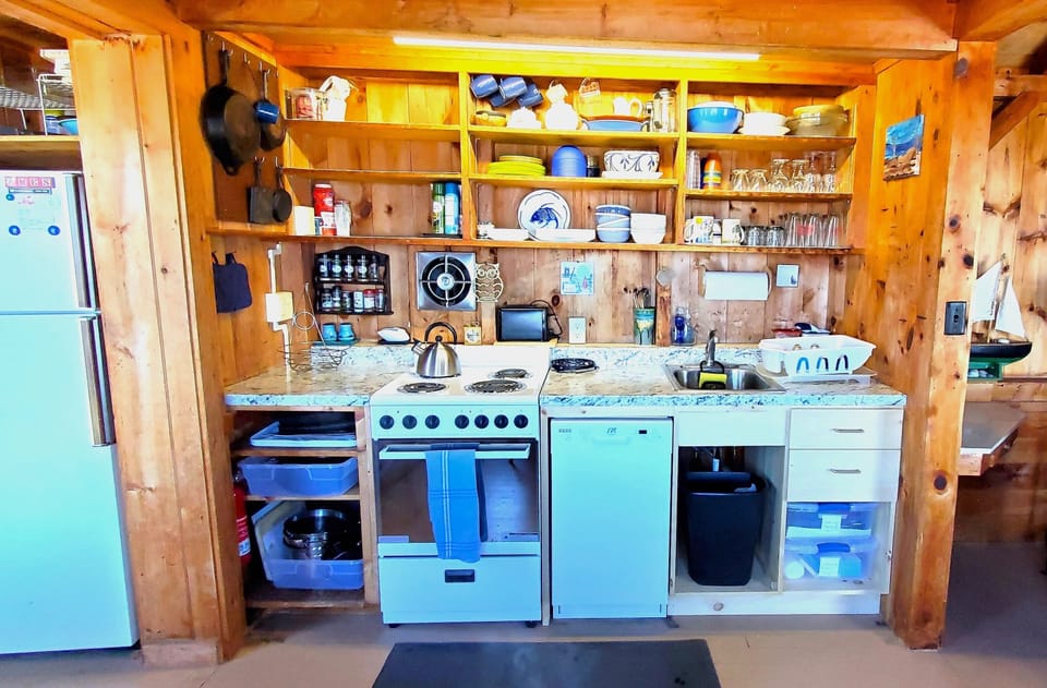 full kitchen, dishwasher, dishes, etc