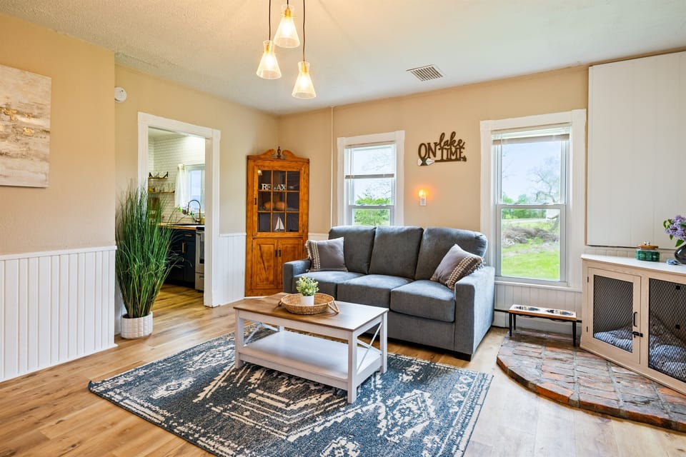 Charming living room with stylish wood accents and an open view into a beautifully updated kitchen — perfect for relaxing or entertaining. 🛋️✨