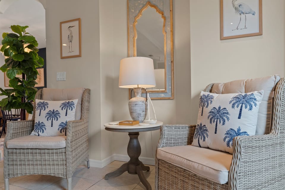 Cozy wicker chairs in living room provide additional seating options
