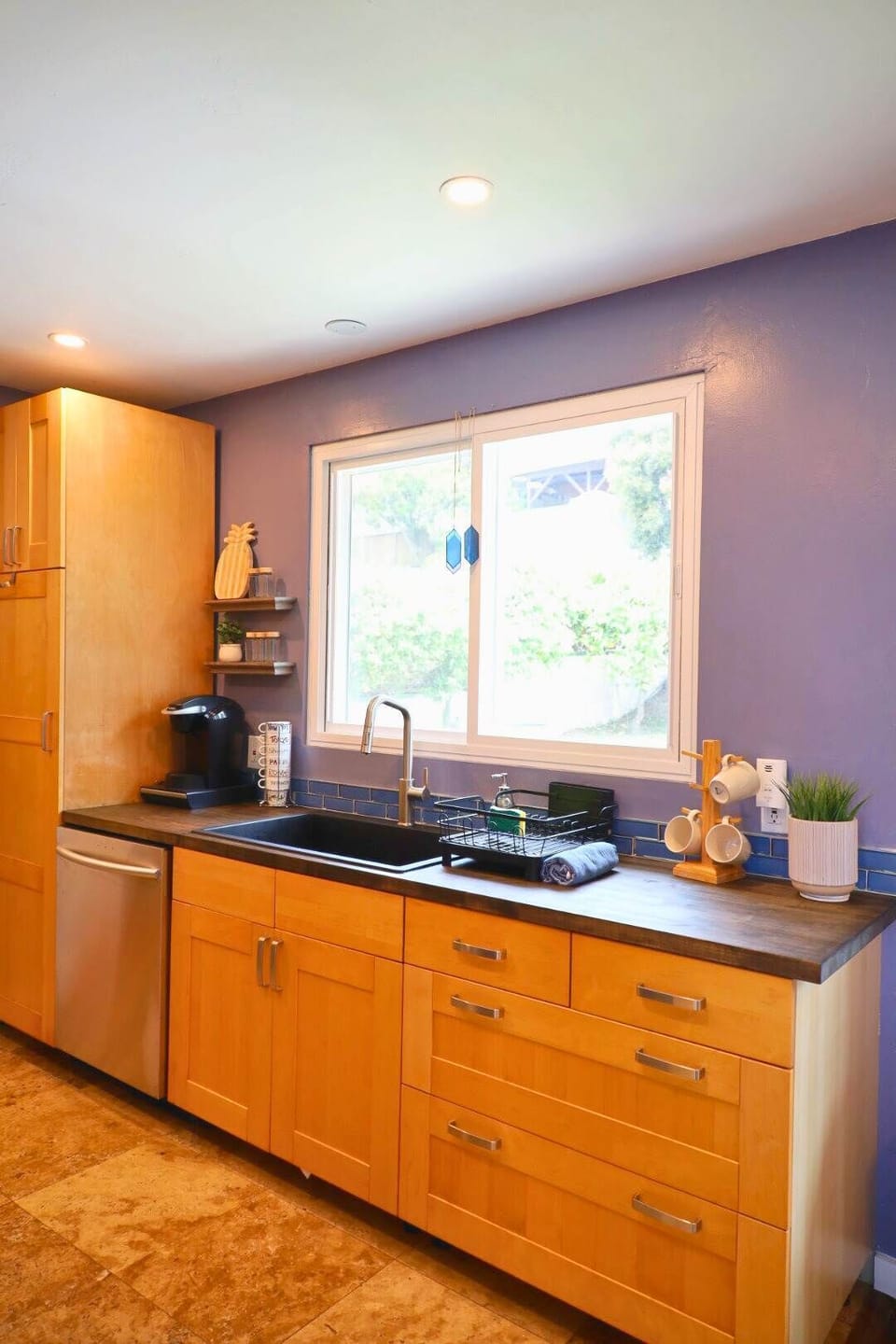 Bright and stylish kitchen, fully equipped with modern appliances, a spacious dining area, and unique decor perfect for families, groups, and gatherings in sunny San Diego!