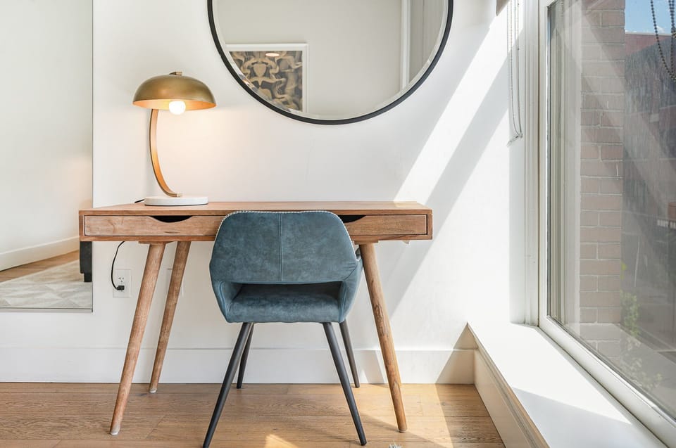Unit 1: Primary bedroom featuring a King bed, work station, and a closet.