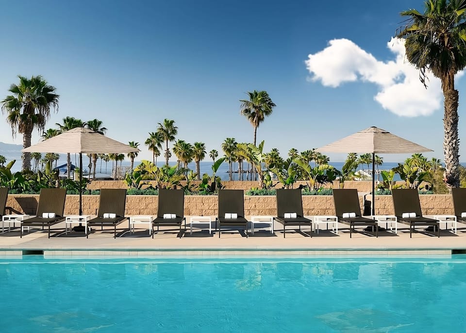 Lounge poolside under palms and soak up the sunshine.