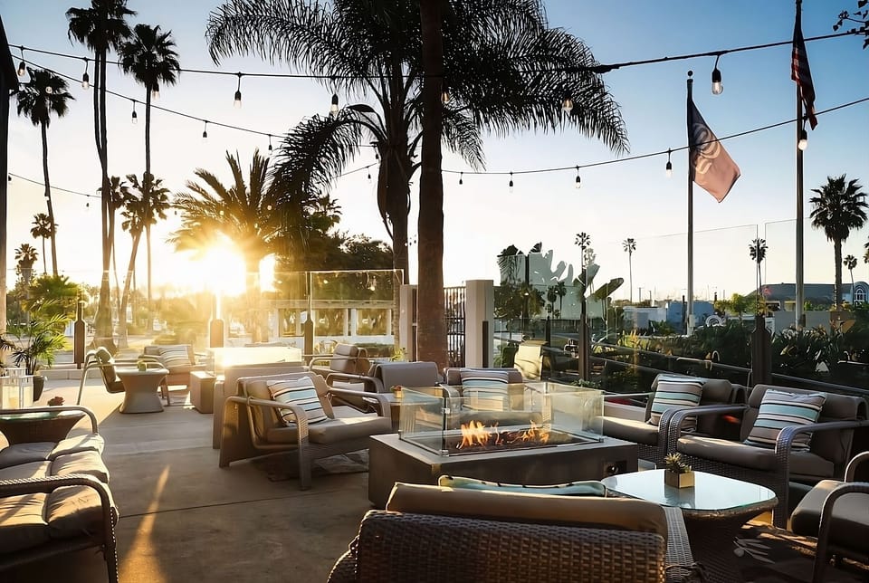 Unwind with friends as the sky glows over the patio.