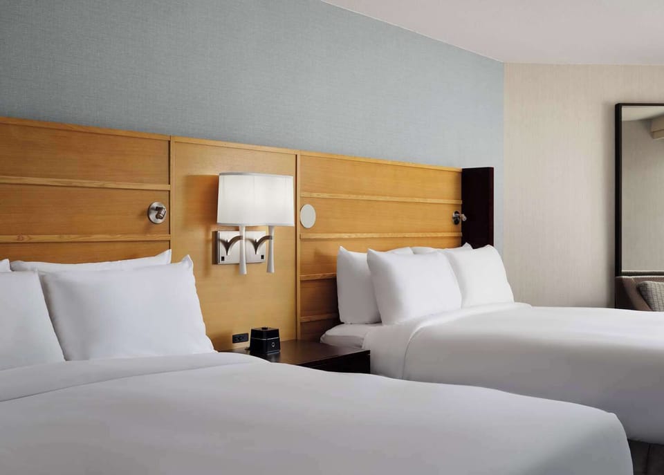 Settle in with roomy beds and warm, modern finishes.