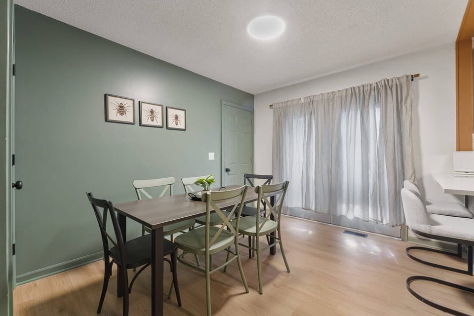 Dinner table with seating for six within the kitchen. 