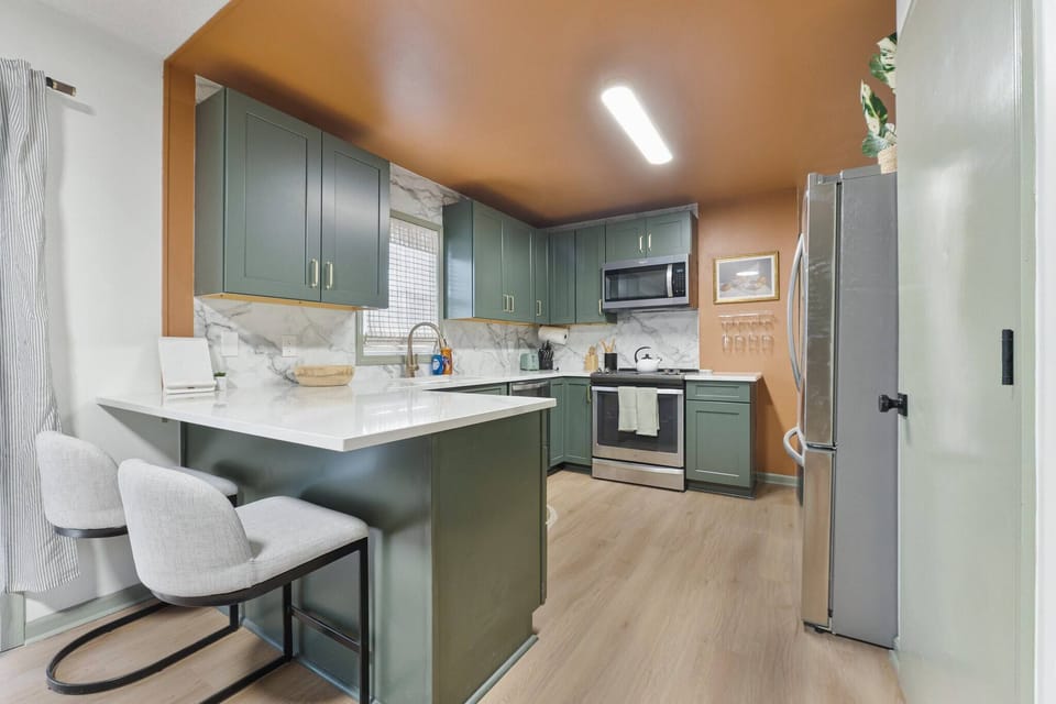 Plenty of counter space and some additional seating in this large fully equipped kitchen. 