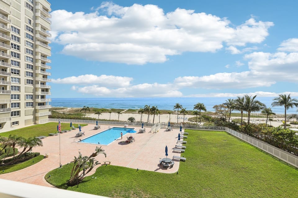 Sip your morning coffee or evening wine with front-row views of the beach.
