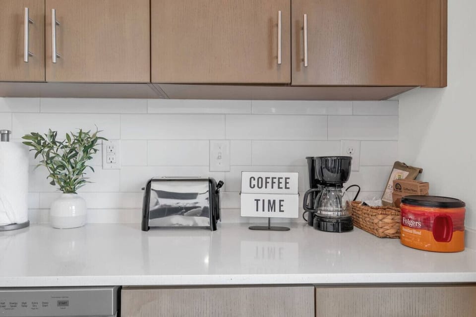 - Fully stocked coffee station with drip maker and toaster   - Quartz countertops with subway tile backsplash and storage   - Gourmet kitchen setup ideal for extended stays