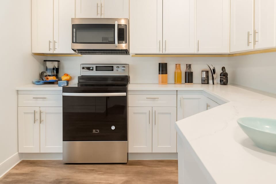 Bright, spotless kitchen ready for your home-cooked meals.