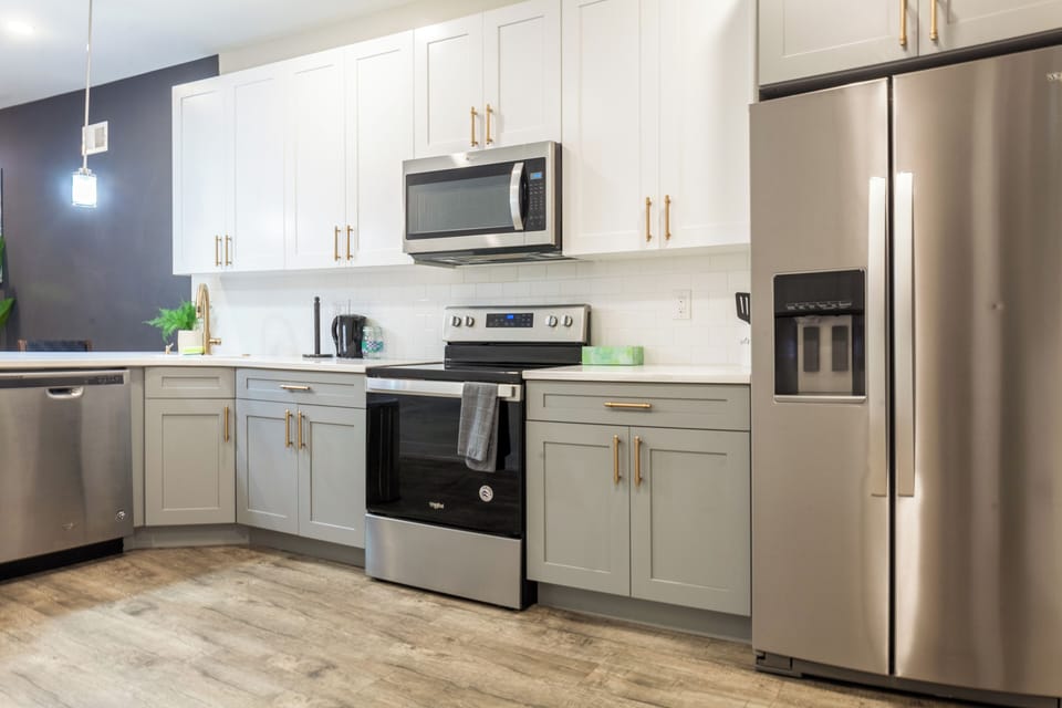 Fully equipped kitchen with all essentials, including a stove, fridge, microwave, and coffee maker—perfect for home-cooked meals.