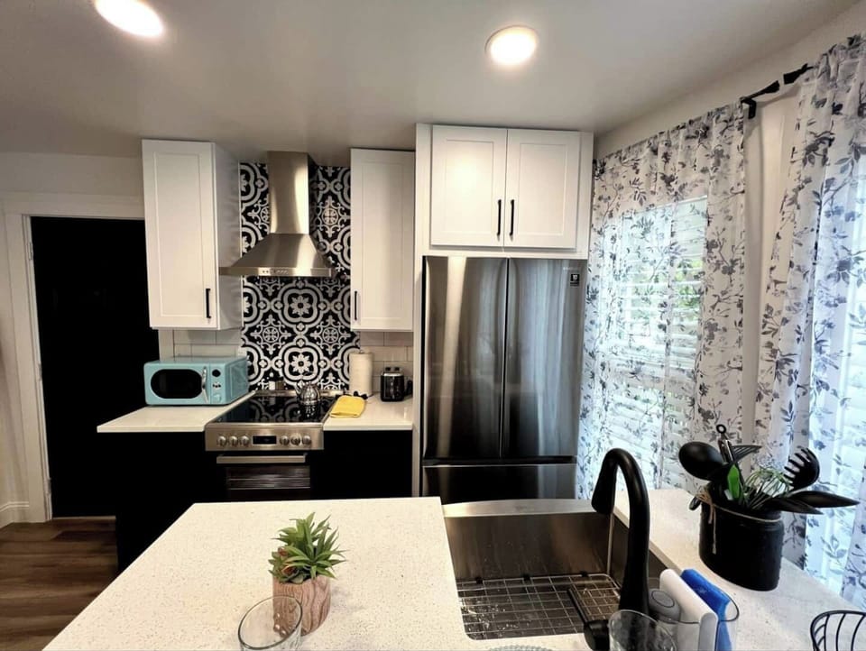 A sleek and spotless bathroom designed for your daily rituals. Fresh towels, essentials, and calming vibes included