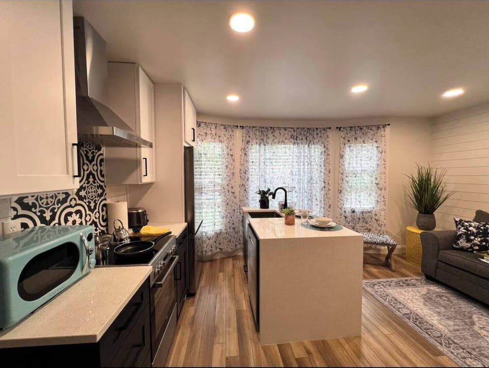 A sleek and spotless bathroom designed for your daily rituals. Fresh towels, essentials, and calming vibes included