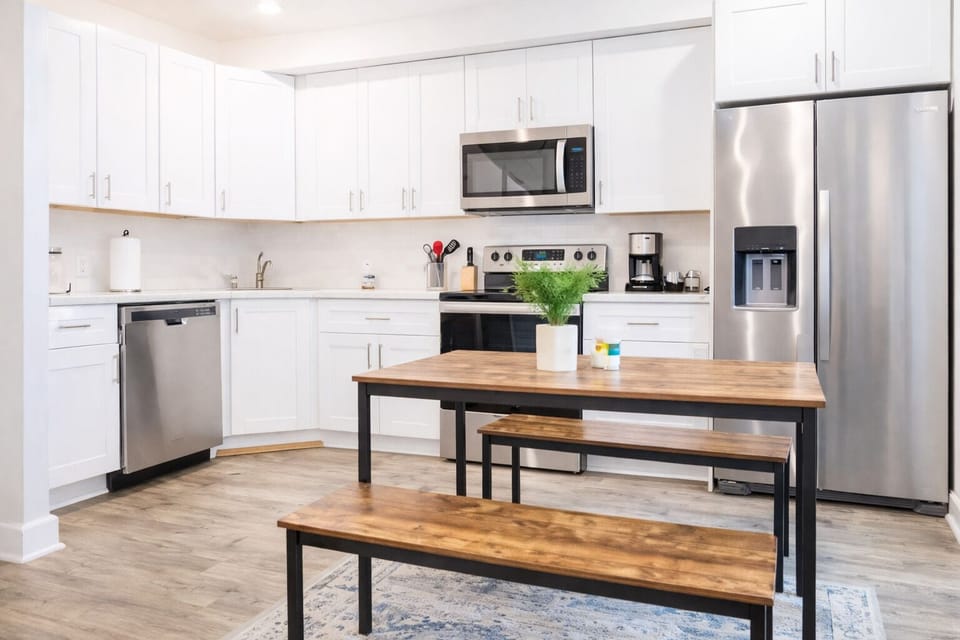 Modern kitchen with sleek countertops and all essential cooking amenities.