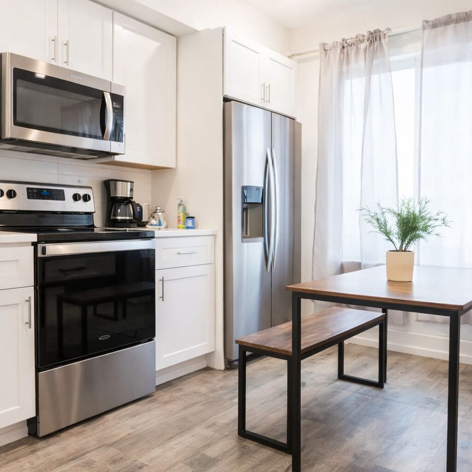 Modern kitchen with sleek countertops and all essential cooking amenities.