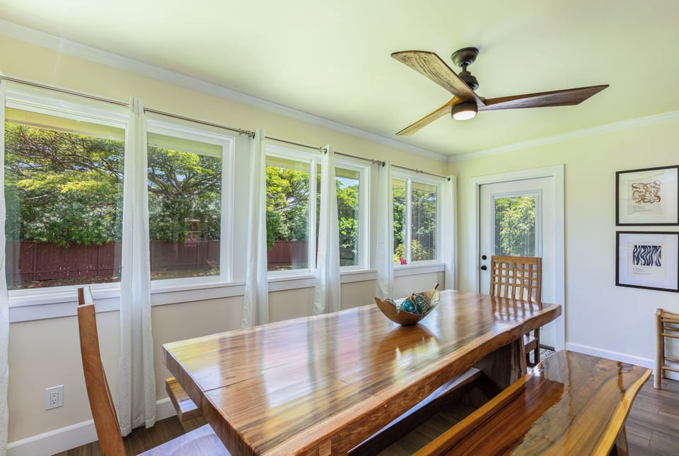 Oversized Monkeypod dining table with plenty of seating for the whole group.
