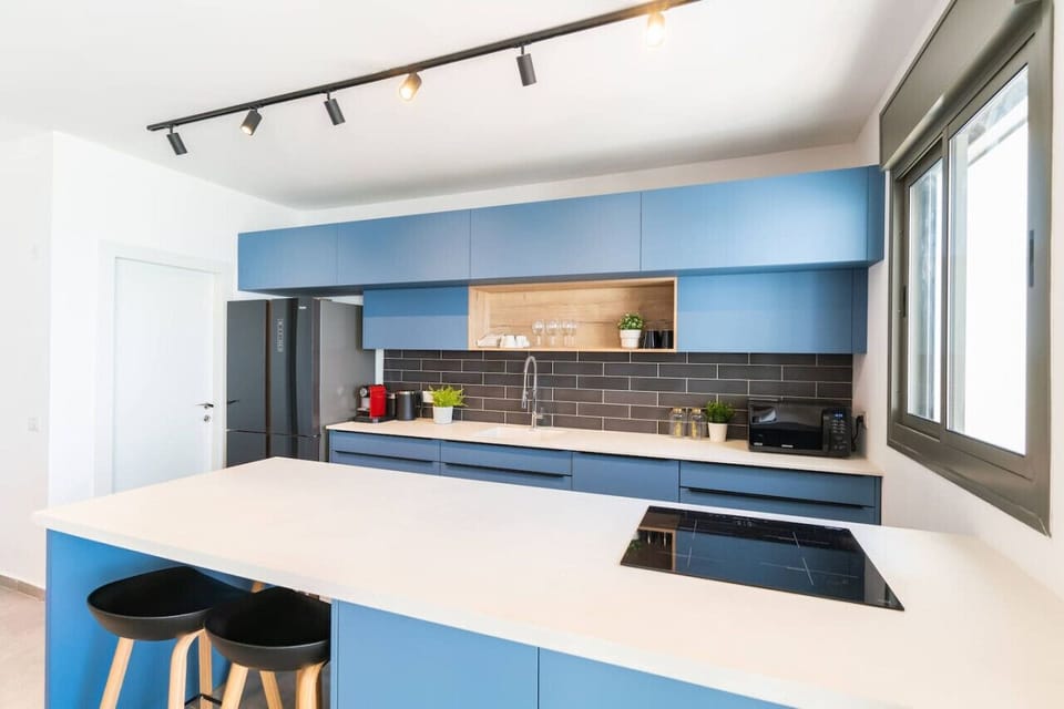 Clean kitchen counter, dining area