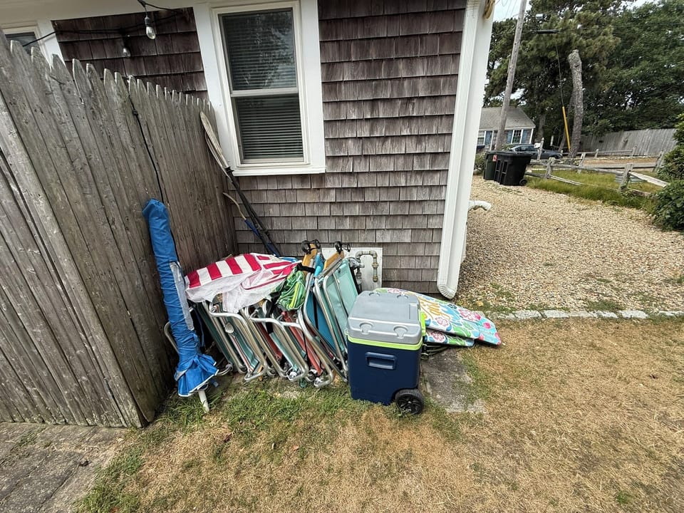 beach chairs, umbrella, boogie boards and cooler to use