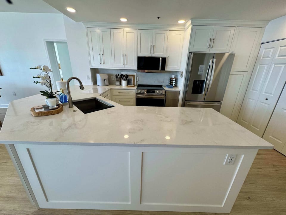 Kitchen with large washing machine and dryer 