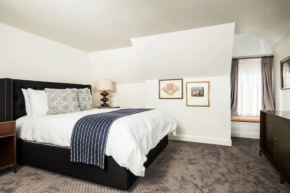 Stretch out on a cloud-soft bed in a calming retreat.