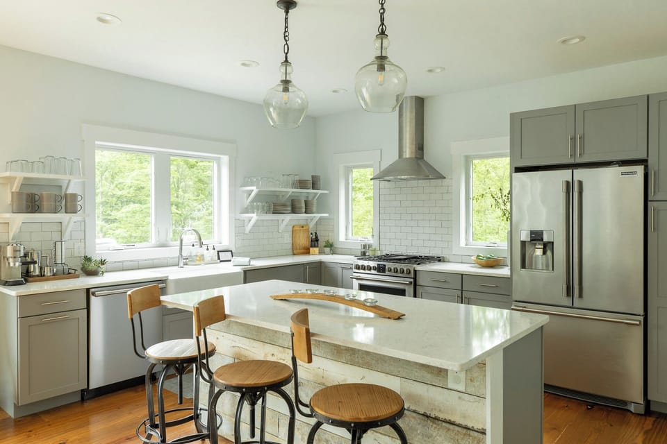 Chef-friendly kitchen with island, open shelves, and natural light.