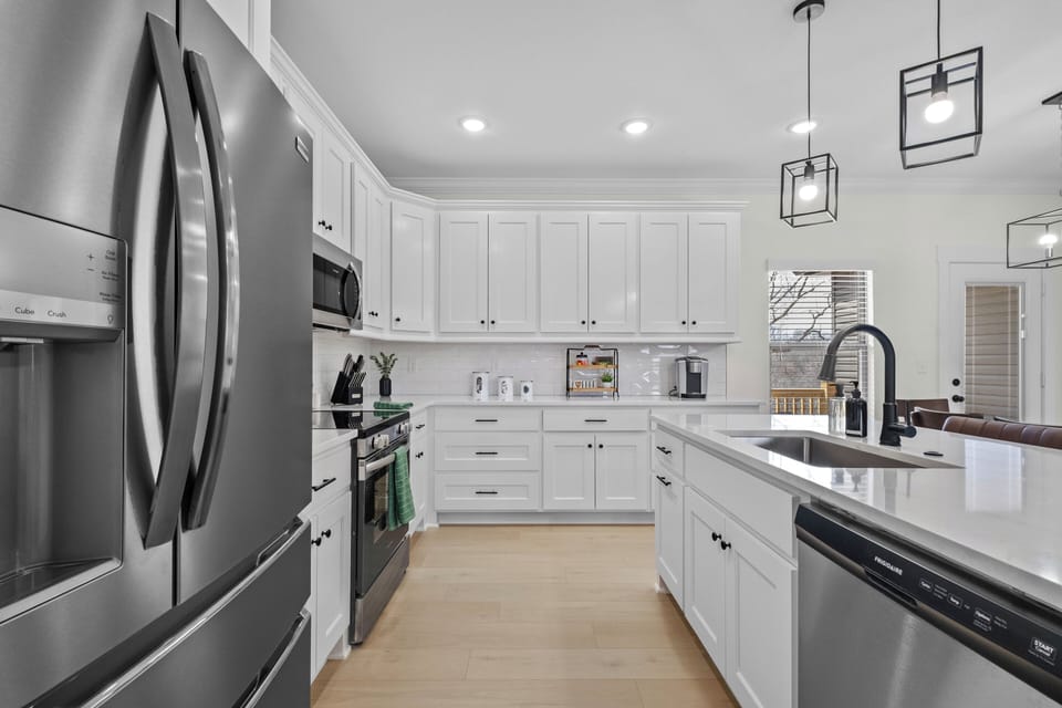 Fully stocked kitchen for your cooking & baking needs & seating for 3 at bar!