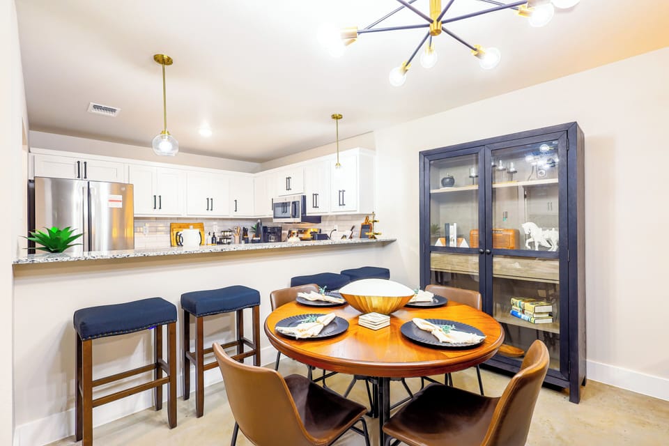 Gather for meals or games around this cozy dining table for four.