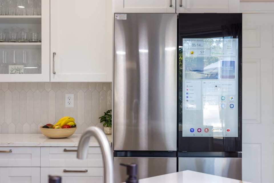 Smart fridge convenience in a sleek, modern chef’s kitchen.