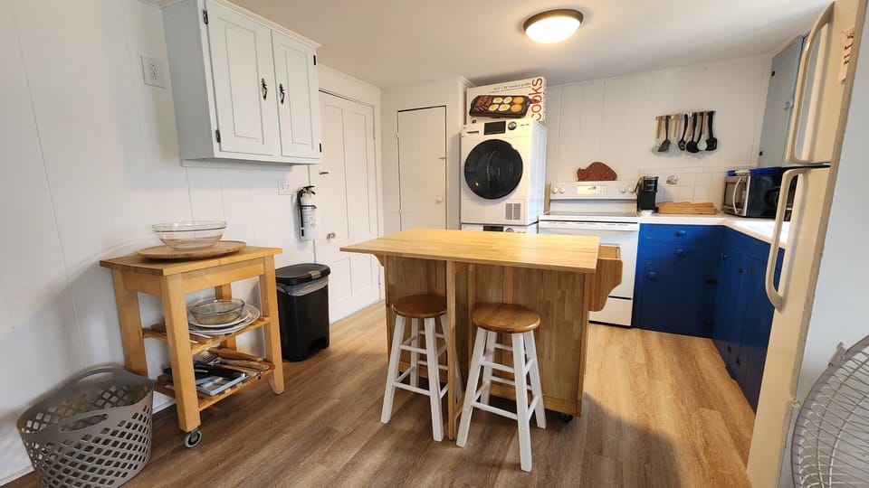 Kitchen with island bar with seating