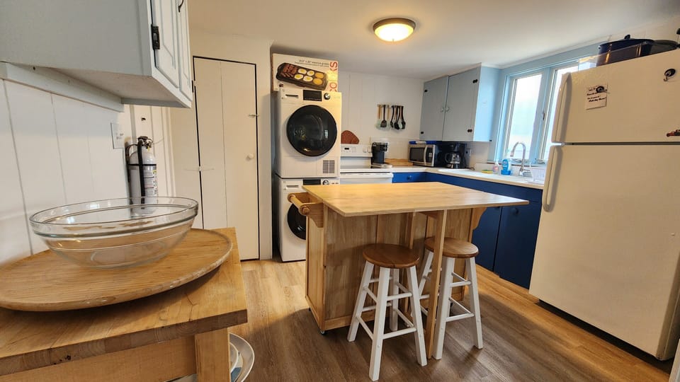 Kitchen with new stacked washer/dryer