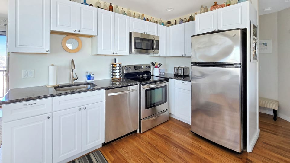 Nicely equipped kitchen with stainless appliances