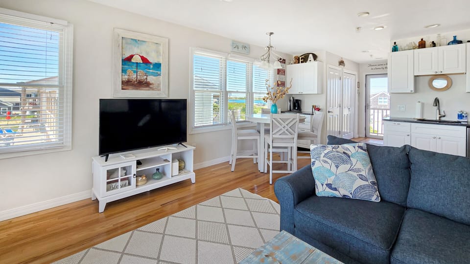 Living room with comfortable seating and large flat screen TV