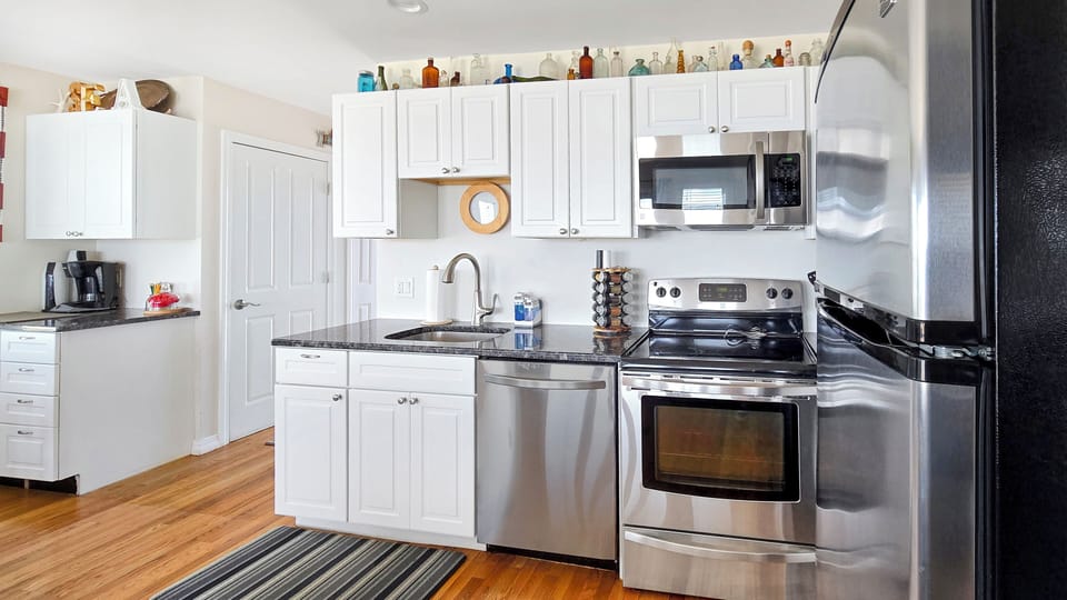 Nicely equipped kitchen with stainless appliances