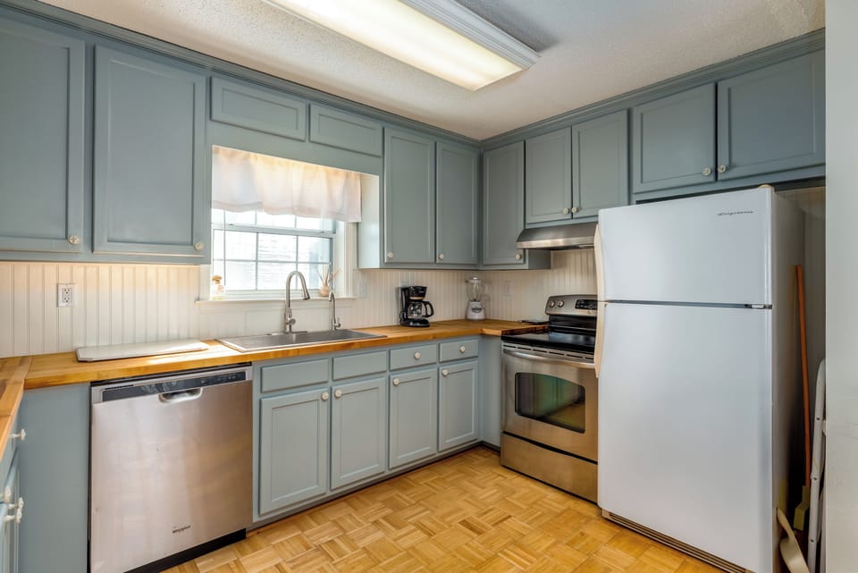Your fully equipped kitchen features stainless steel appliances, and warm wood countertops for comfortable meal prep.