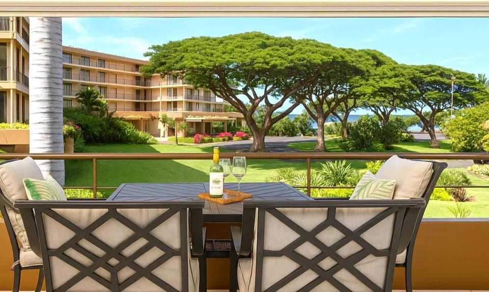 Relax in shaded serenity while gazing out at vibrant gardens, sweeping green lawns, and majestic, sculpted canopy trees MKV-B247