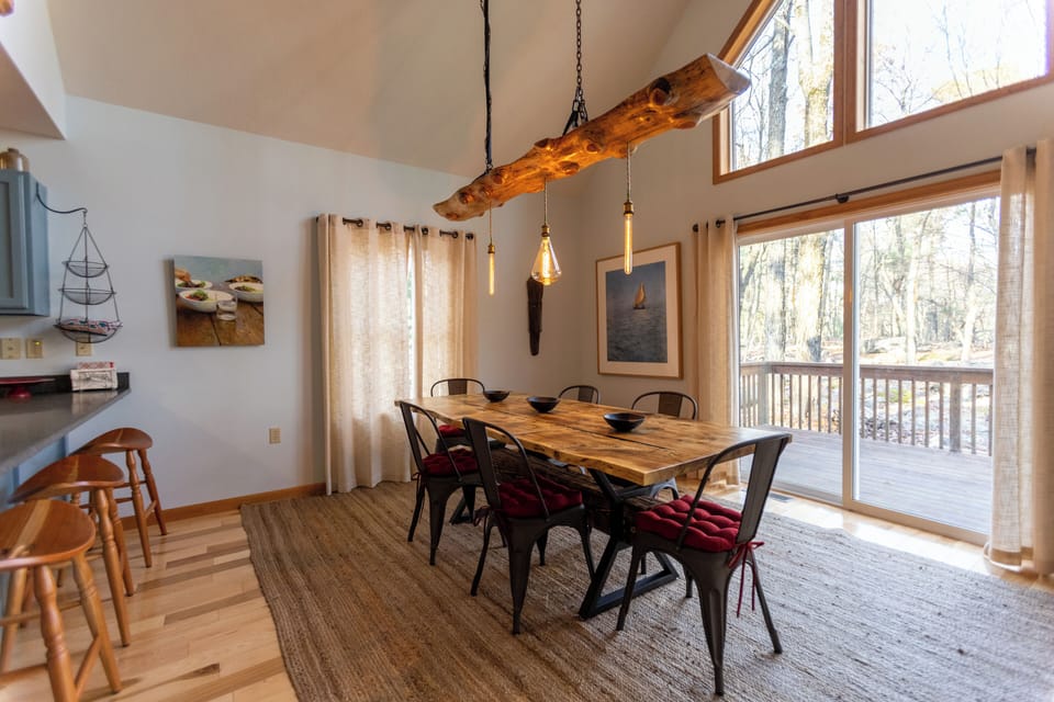 Warm pendant lights create a welcoming glow.