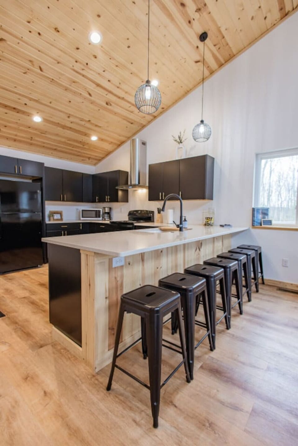 Kitchen view right as you come down the stairs — warm and welcoming!
