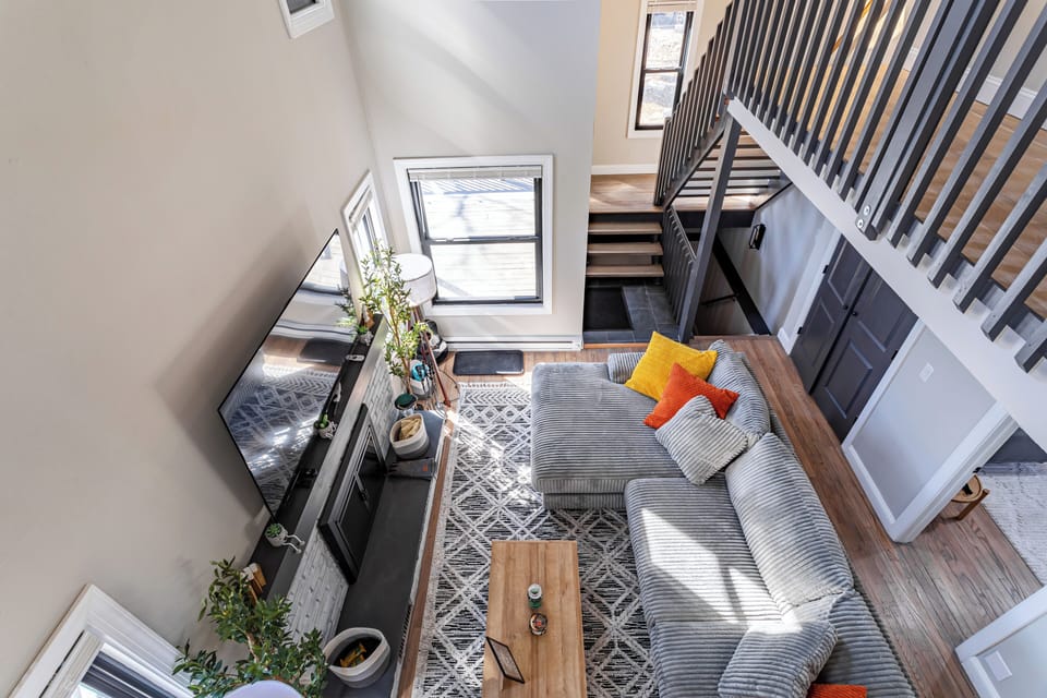 Open-concept view of living space from the upper loft.