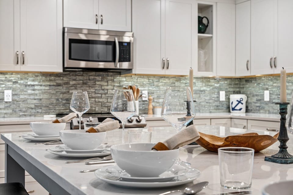 A cozy, elegant kitchen set for a meal.