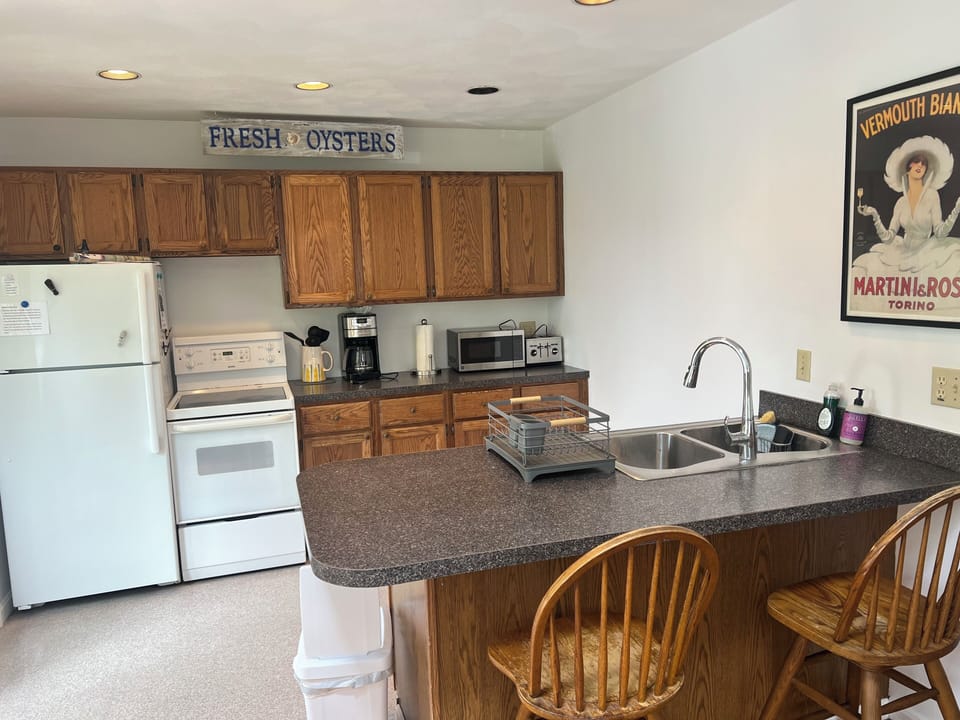 Fridge, oven, coffee maker, toaster, microwave, fiesta ware plates etc.