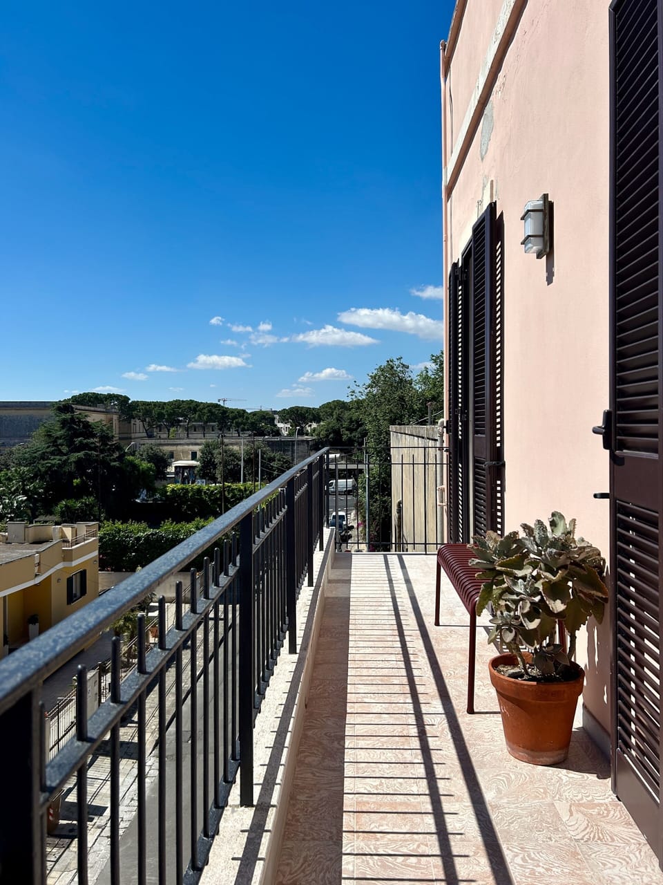 Overlooking the leafy neighbourhood on one side is the sun-kissed front balcony
