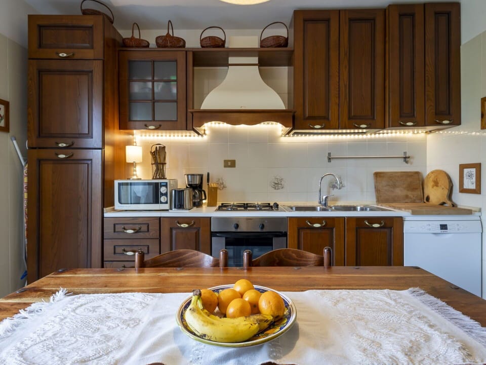 Kitchen, Countertop, Furniture, Kitchen Appliance, Cabinetry, Interior Design, Wood, Major Appliance, Room, Cupboard