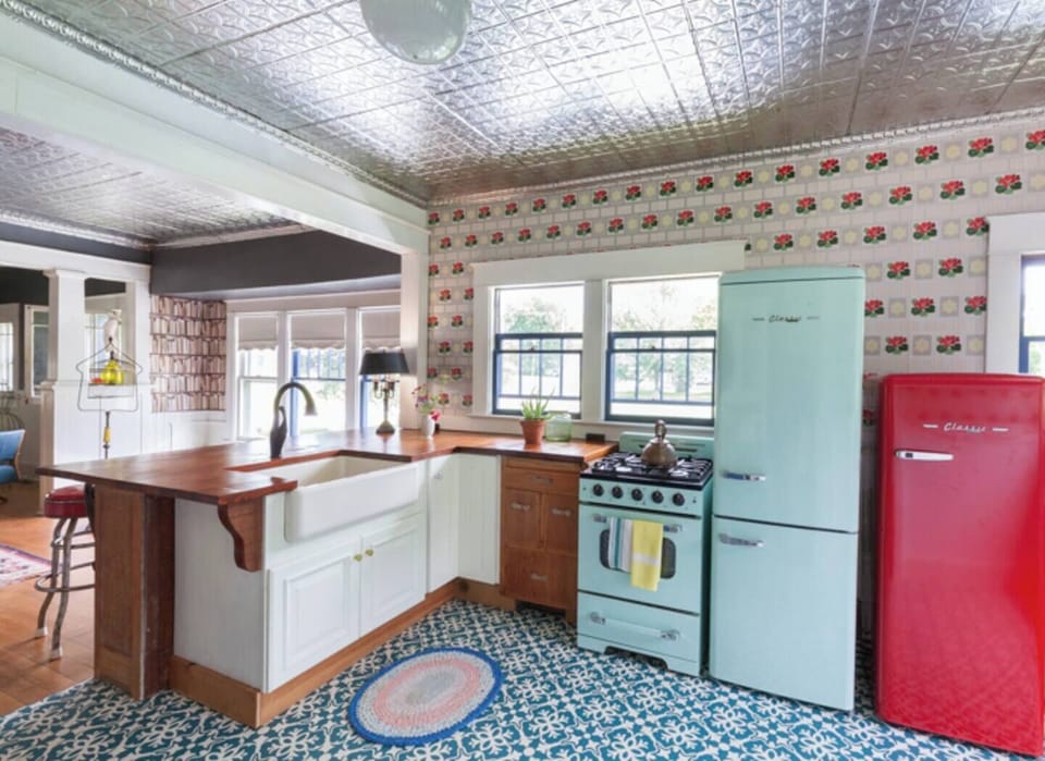Kitchen with modern retro appliances.  Farm-house sink.  Gas stove.
