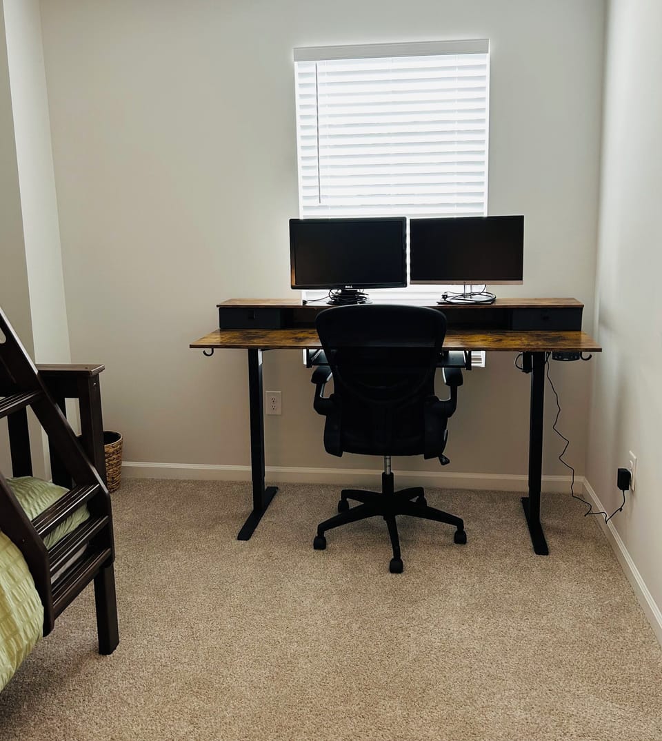 Working area with computer monitors in 3rd bedroom