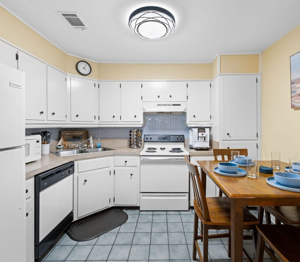 Step into this bright and cheerful kitchen, where coastal charm meets everyday convenience.