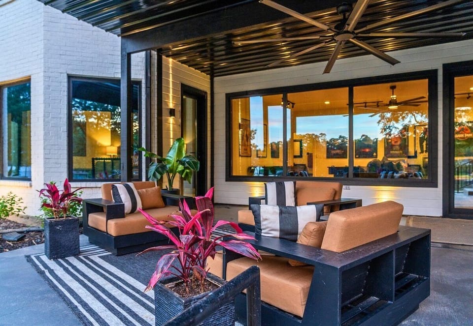 Sleek design meets cozy comfort in this stylish outdoor lounge—perfect for morning coffee or evening cocktails.
