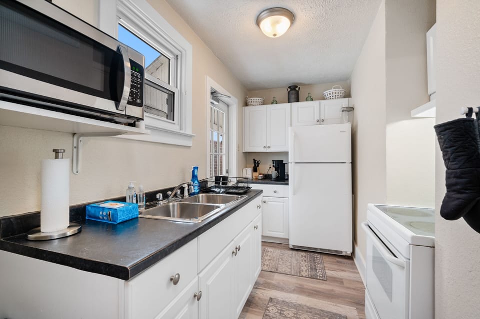 Full kitchen equipped with cooking essentials.